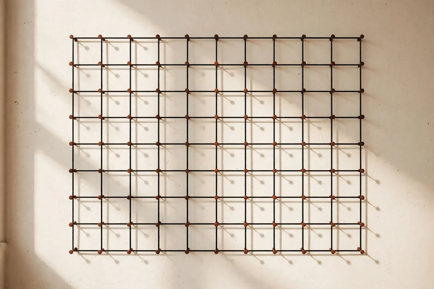 A wall planner with pins